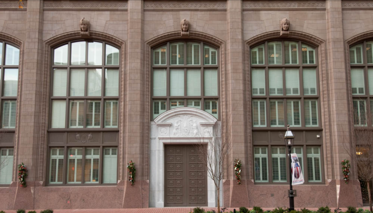 Commercial building facade featuring cast stone keystones and arched windows